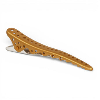 Phullcutz Y.S. Park Shark Clip aus goldfarbenem Aluminium mit Haizahn-Struktur und Lochdesign für festen Halt